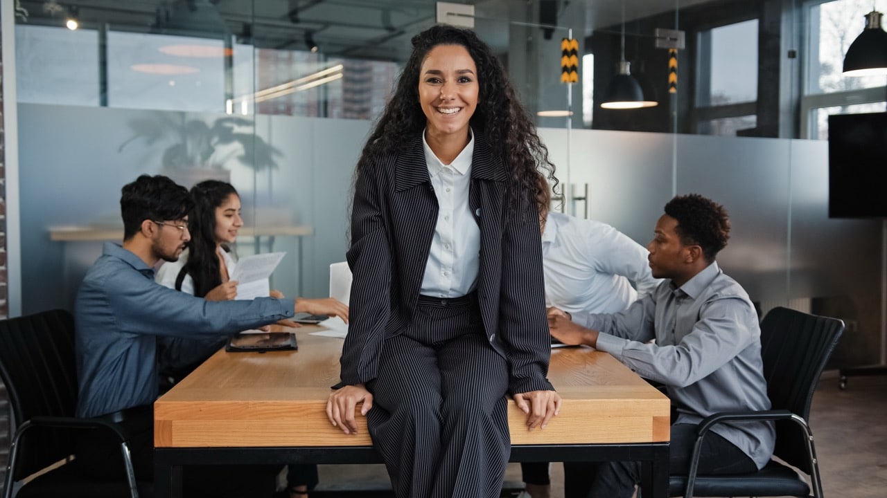 executive search agency office with woman sat on a desk